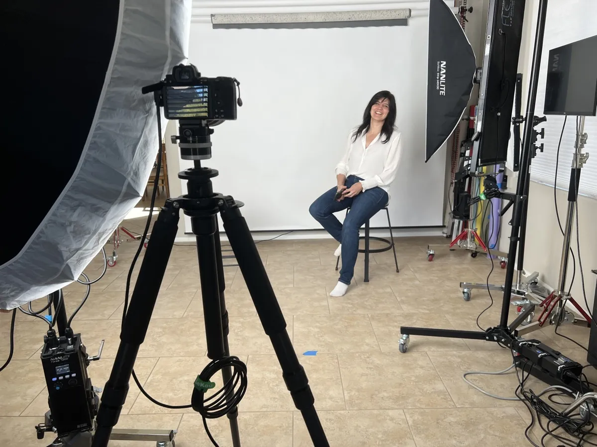 Marie Feutrier behind the scenes photographing a professional headshot client at her Phoenix studio