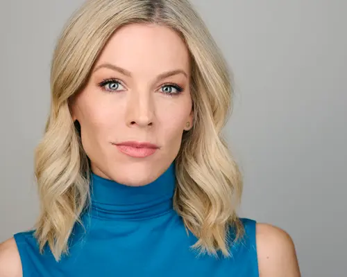 Professional actress headshot with clean blue neckline drawing attention to face in Phoenix studio