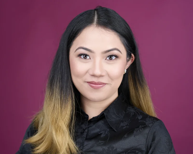 Professional corporate headshot of a woman with natural satin-finish makeup and polished brows photographed in Phoenix studio