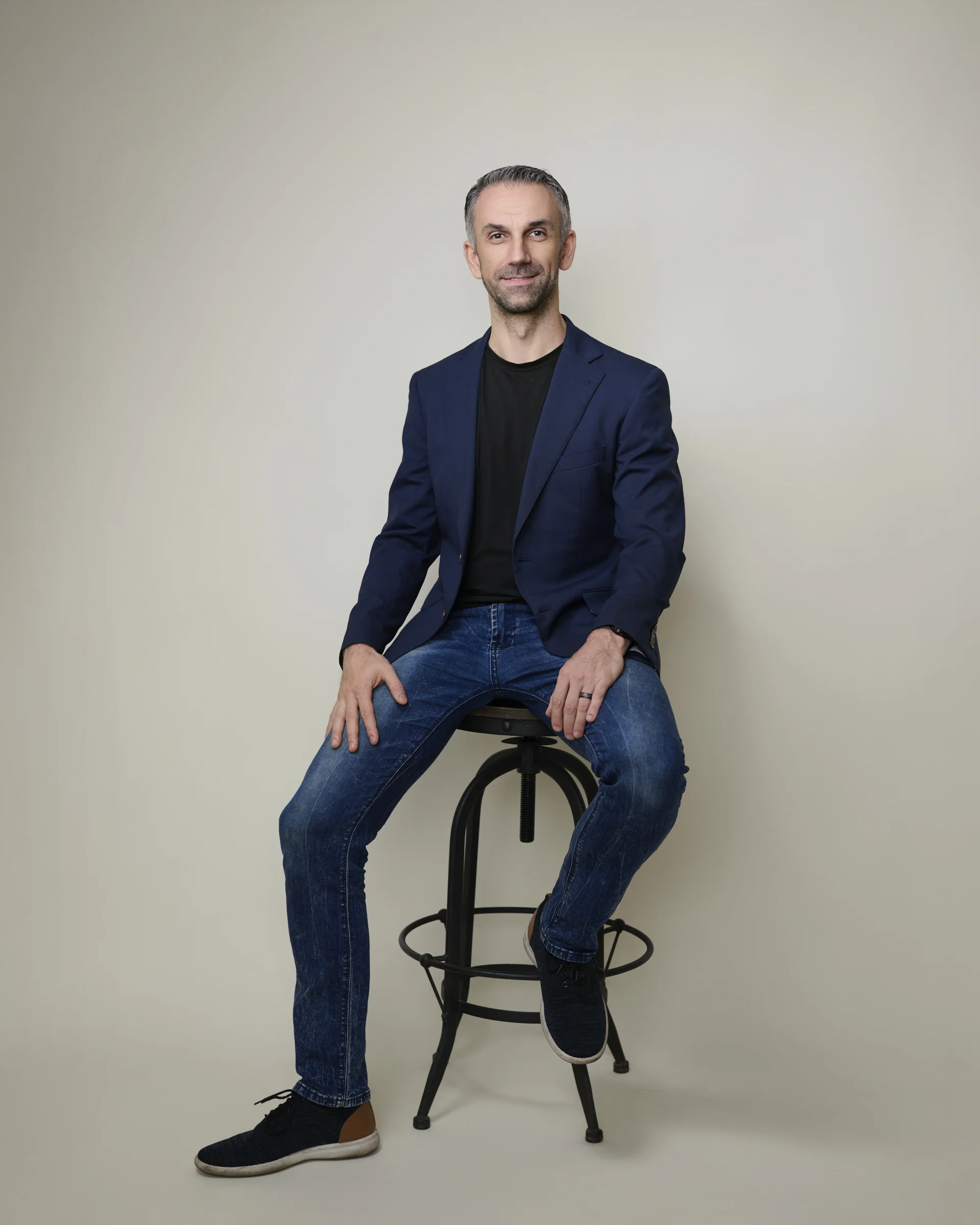 Jeans and a blazer — the sweet spot between authority and approachability that works on almost everyone