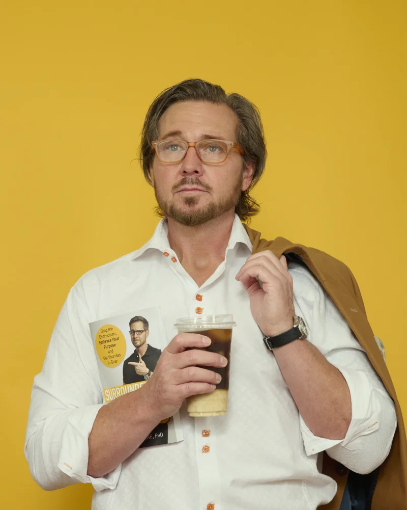 Man in a navy suit with a floral statement tie showing how color and pattern can add personality to a professional headshot
