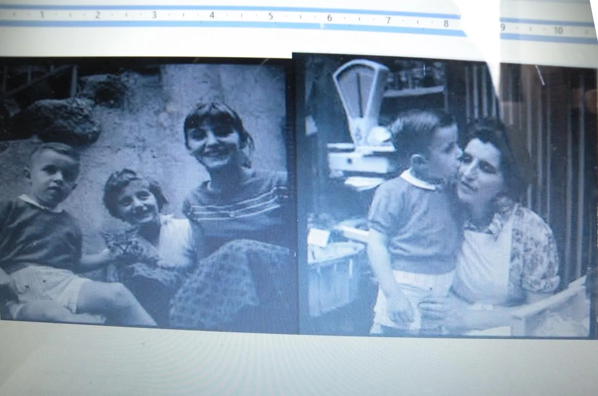 Contact sheet by Vivian Maier showing two candid moments of siblings in Saint-Bonnet-En-Champsaur: left frame captures three children together, right frame shows tender moment of sister kissing brother on cheek with genuine affection, French Alps village setting, 1959