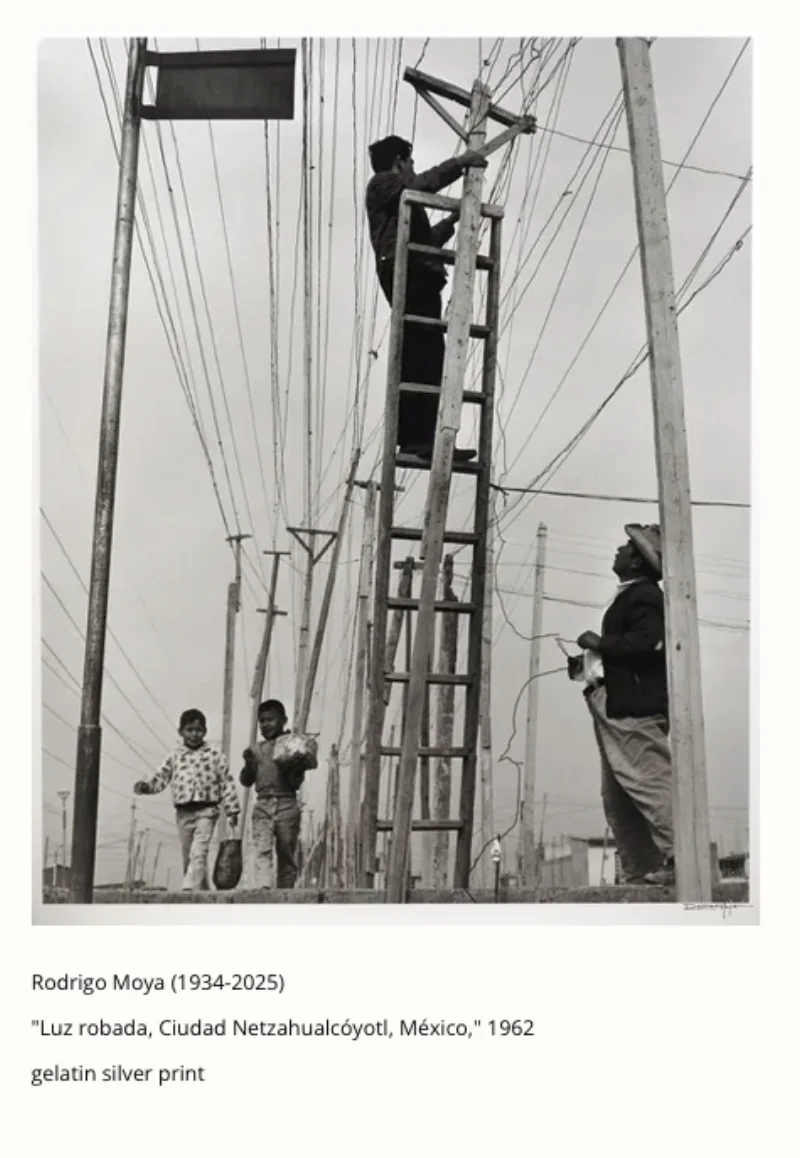 A man on a ladder working power lines while children walk past below in Ciudad Netzahualcóyotl, Mexico, 1962 — gelatin silver print by Rodrigo Moya