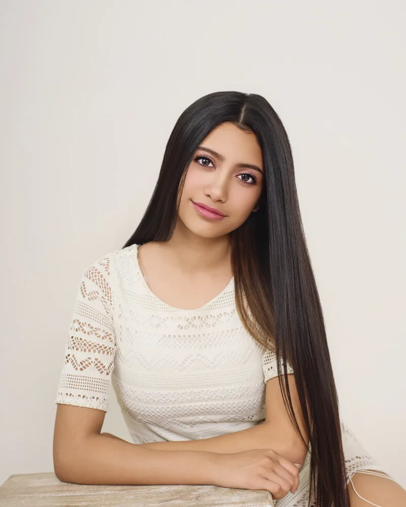 Bright, polished beauty portrait with soft makeup and warm color photographed by Marie Feutrier