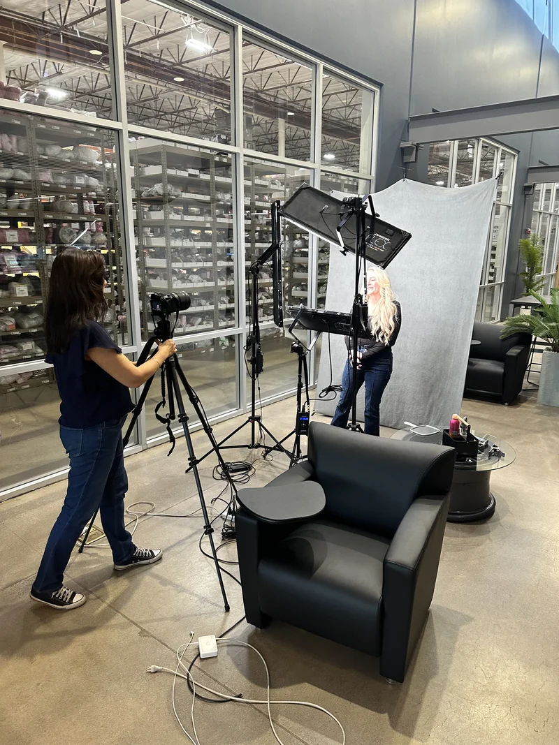 Photographer Marie Feutrier shooting on-location team headshots at Wyatt Aerospace in Gilbert Arizona with professional lighting setup