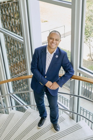 Stefano McGhee on a curved interior staircase